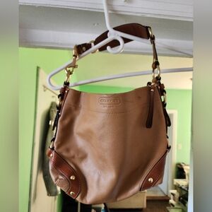 Coach women's genuine, soft, textured leather bag.